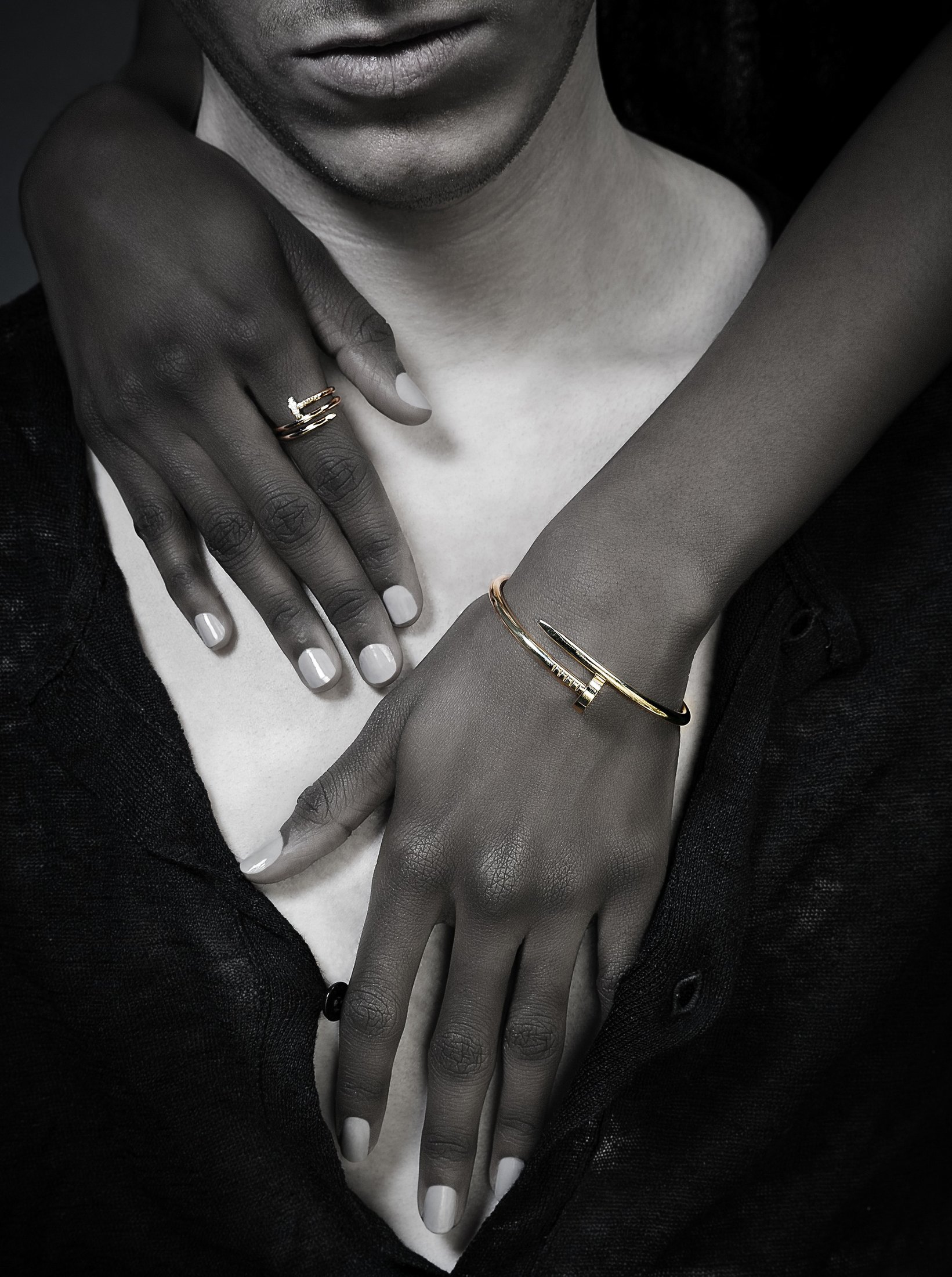 Juste un Clou ring and bracelet on a hand across the chest