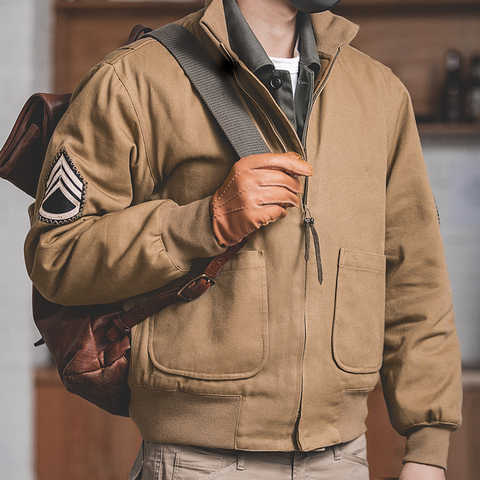Куртка-бомбер мужская коричневая, с нашивками и воротником-стойкой 4000296327498