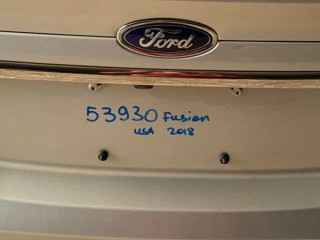 накладка двери (крышки) багажника Ford Fusion (USA) 2 поколение [рестайлинг] 2018, 2.0 л., TPWA, бензин, АКПП, pn4ag0 - ingot silver metallic, седан, полный привод