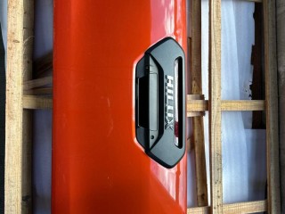 борт откидной Toyota Hilux 8 поколение [рестайлинг] 2022, 2.8 л., 1GD-FTV, дизель, АКПП, красный, пикап, полный привод, правый руль, 65700-KK010