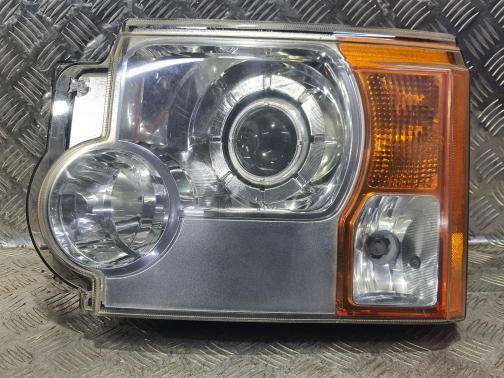 фара левая Land Rover Discovery 3 поколение (2004 - 2009), правый руль, XBC500092 - фото №1