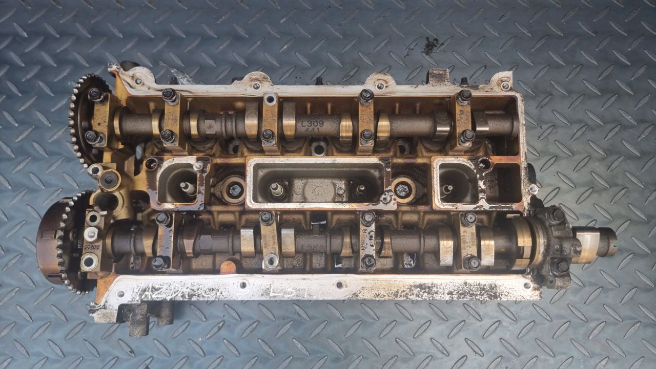 головка блока цилиндров Mazda CX-7 1 поколение (2006 - 2009), 2.3 л., L3-VDT, бензин, L3K910090G, L3K910090F - фото №1