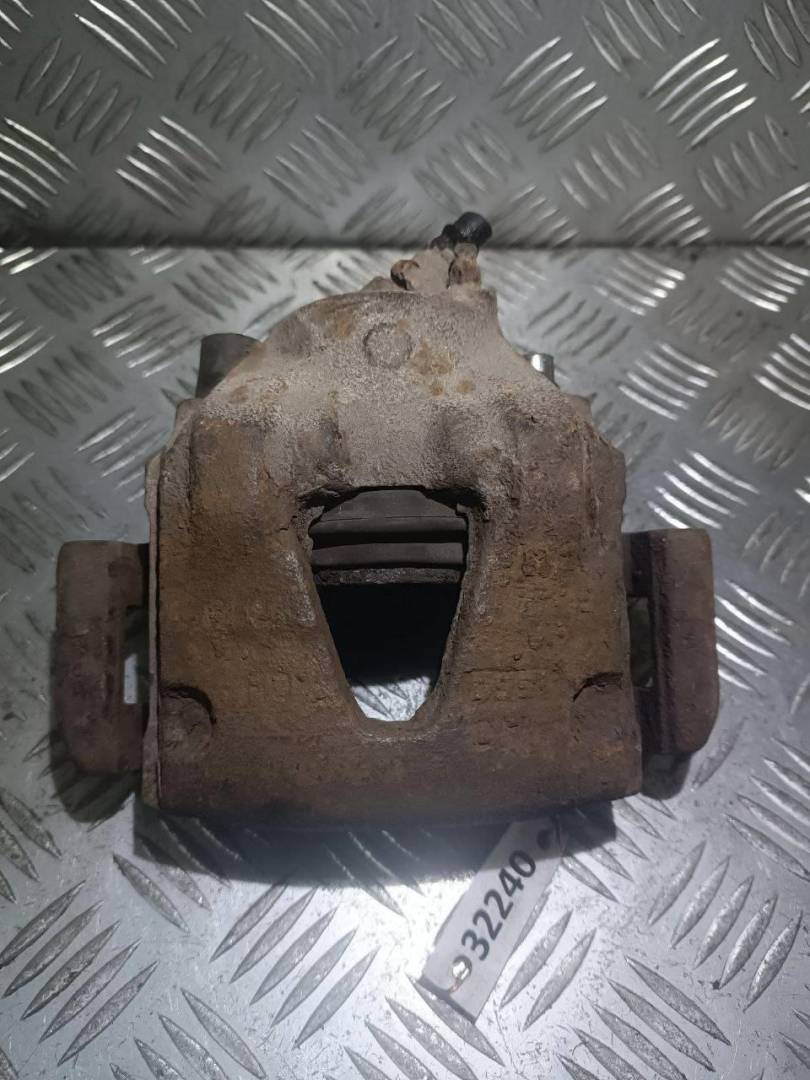 суппорт передний левый Kia Clarus 1 поколение 1997, 1.8 л., i, бензин - фото №1