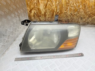 фара левая Mitsubishi Pajero 3 поколение [рестайлинг] 2003, 3.2 л., 4M41, дизель, МКПП, внедорожник 5 дв., 10087420