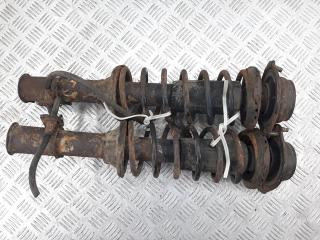 стойка передняя левая Mazda 121 2 поколение 1996