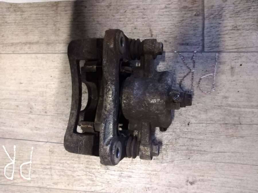 суппорт задний левый Kia Rio 2 поколение 2005, 1.6 л., бензин, хетчбэк 5 дв. - фото №1