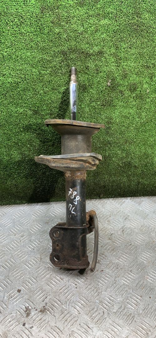 амортизатор передний левый Toyota Carina E 1 поколение T190 1997, 2.0 л., 3S-FE, бензин, МКПП, универсал - фото №1