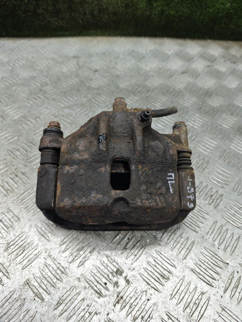 суппорт передний левый Hyundai Accent 2 поколение (LC) 2000, 1.3 л., бензин, МКПП, хетчбэк 3 дв. - фото №1