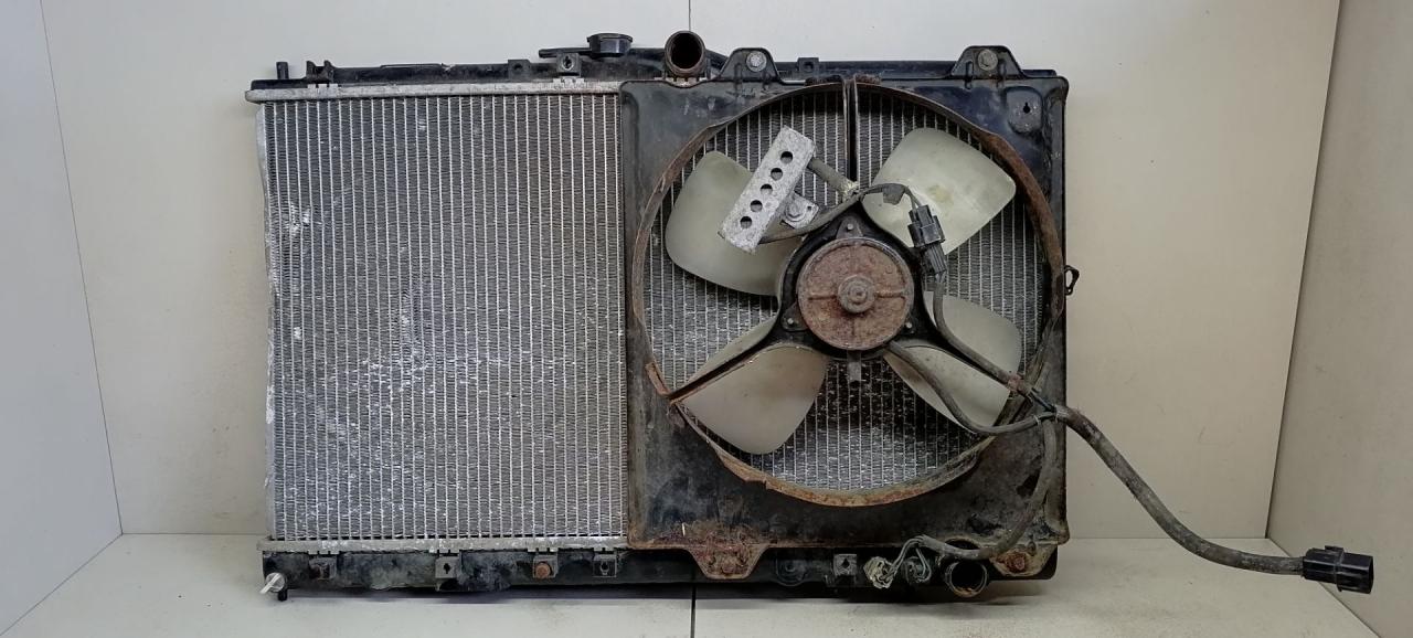 радиатор (основной) Mitsubishi Sigma 1 поколение 1994, 3.0 л., i, 6G72 (DOHC 24V), бензин, 5МКПП, серый металлик, передний привод - фото №1