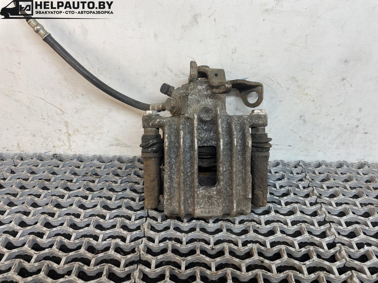 суппорт задний левый Volkswagen Jetta 4 поколение 2001, 2.0 л., AQY, бензин, МКПП, синий, седан, передний привод - фото №1