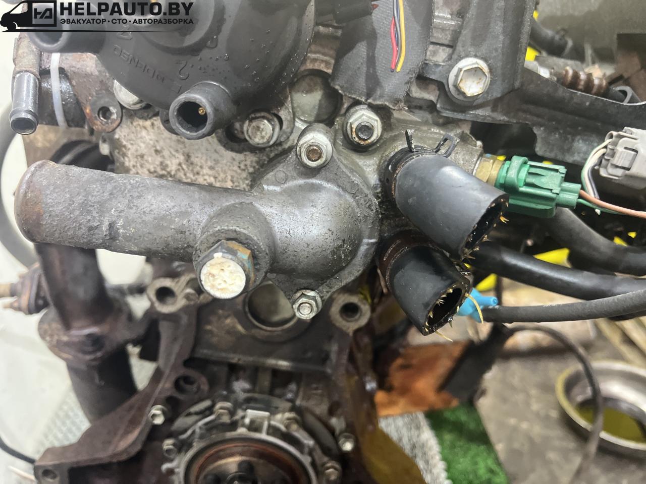 корпус термостата Toyota Carina E 1 поколение T190 1995, 1.6 л., 4A-FE, бензин, МКПП, зелёный, хетчбэк 5 дв., передний привод - фото №1