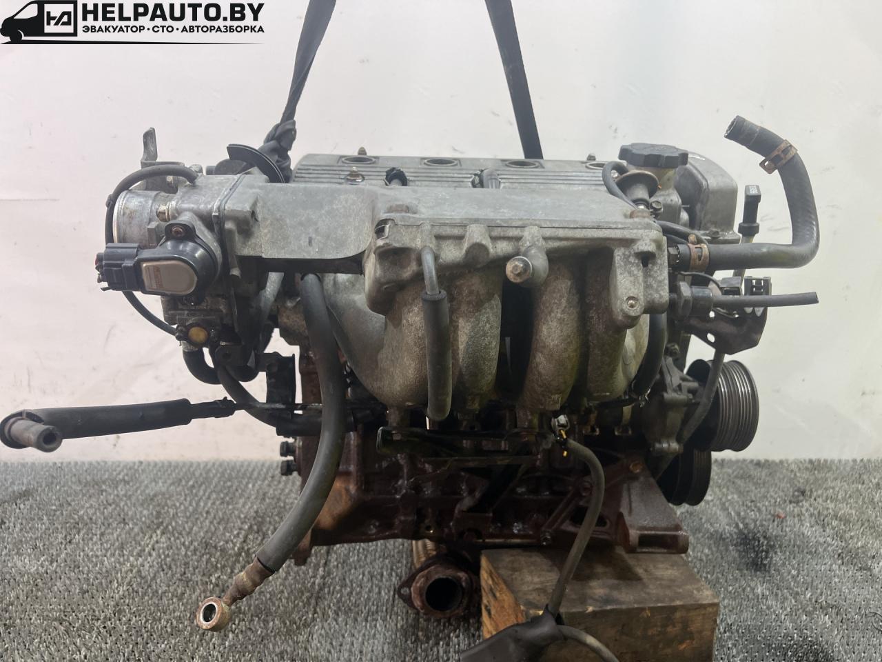 двигатель Toyota Carina E 1 поколение T190 1995, 1.6 л., 4A-FE, бензин, МКПП, зелёный, хетчбэк 5 дв., передний привод, 4A-FE - фото №1