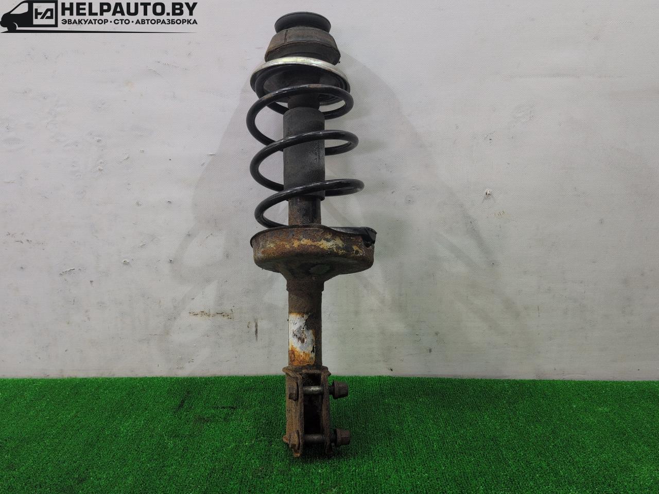 стойка передняя левая Renault Clio 2 поколение 2001, 1.9 л., дизель, МКПП, белый, внедорожник 3 дв. - фото №1