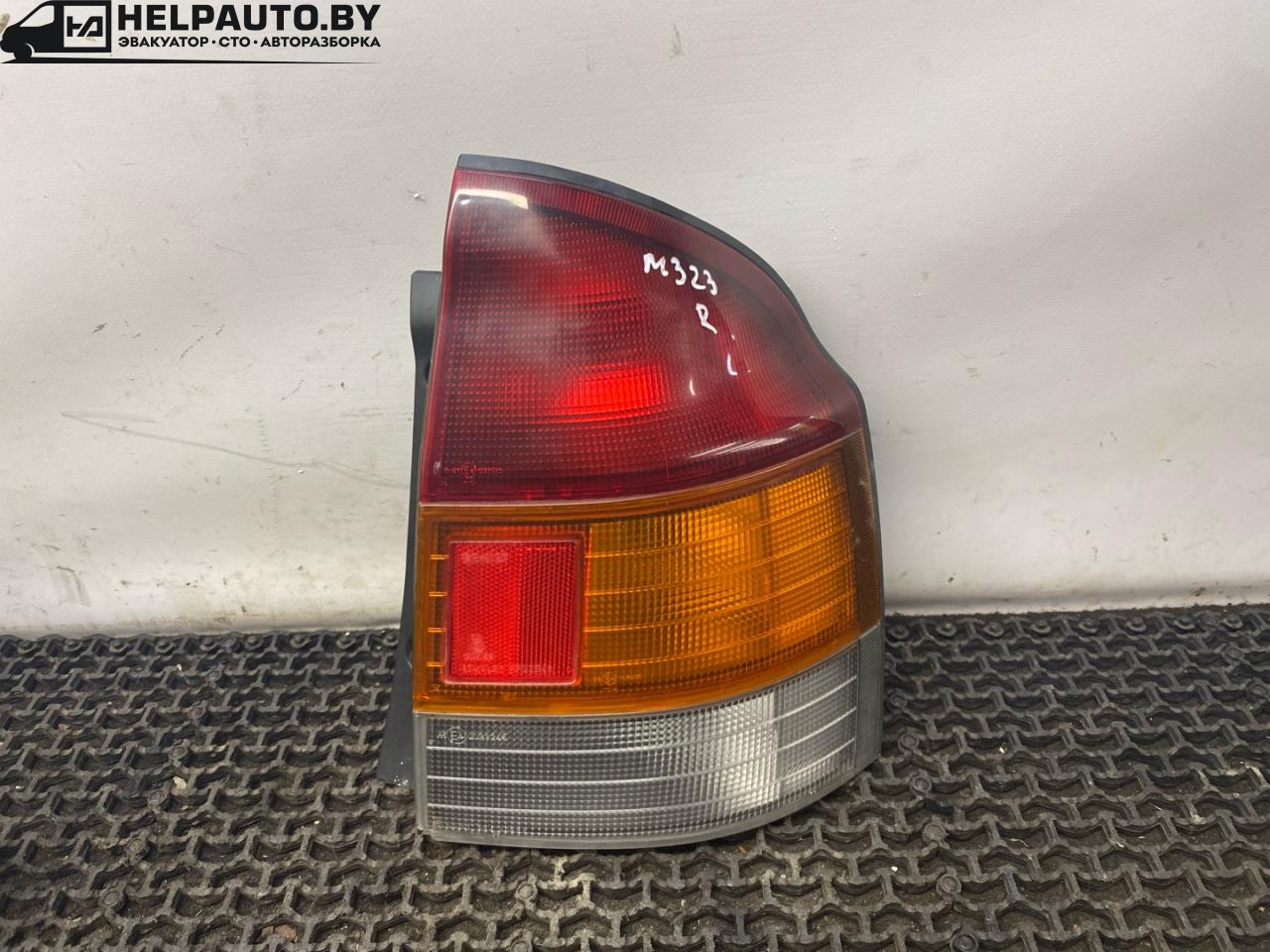 фонарь задний правый Mazda 323 6 поколение 1998, 1.5 л., бензин, МКПП, синий, хетчбэк 3 дв., передний привод, 0023245 - фото №1