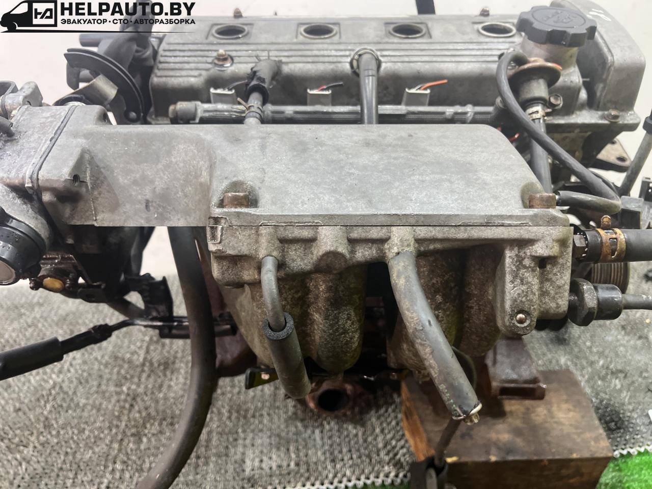 коллектор впускной Toyota Carina E 1 поколение T190 1995, 1.6 л., 4A-FE, бензин, МКПП, зелёный, хетчбэк 5 дв., передний привод, 1710102060 - фото №1