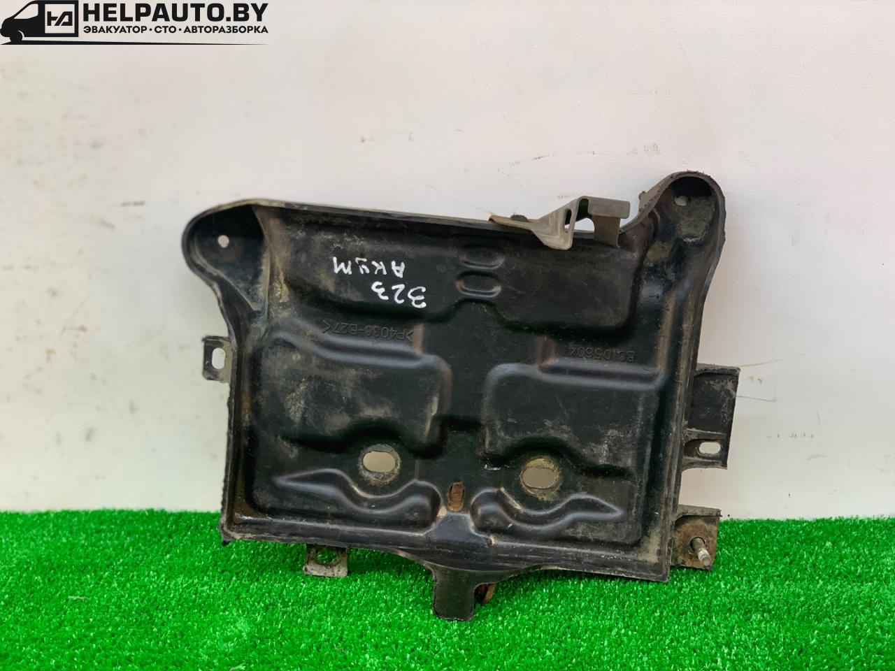 полка аккумулятора Mazda 323 6 поколение 1998, 1.5 л., бензин, МКПП, синий, хетчбэк 3 дв., передний привод - фото №1