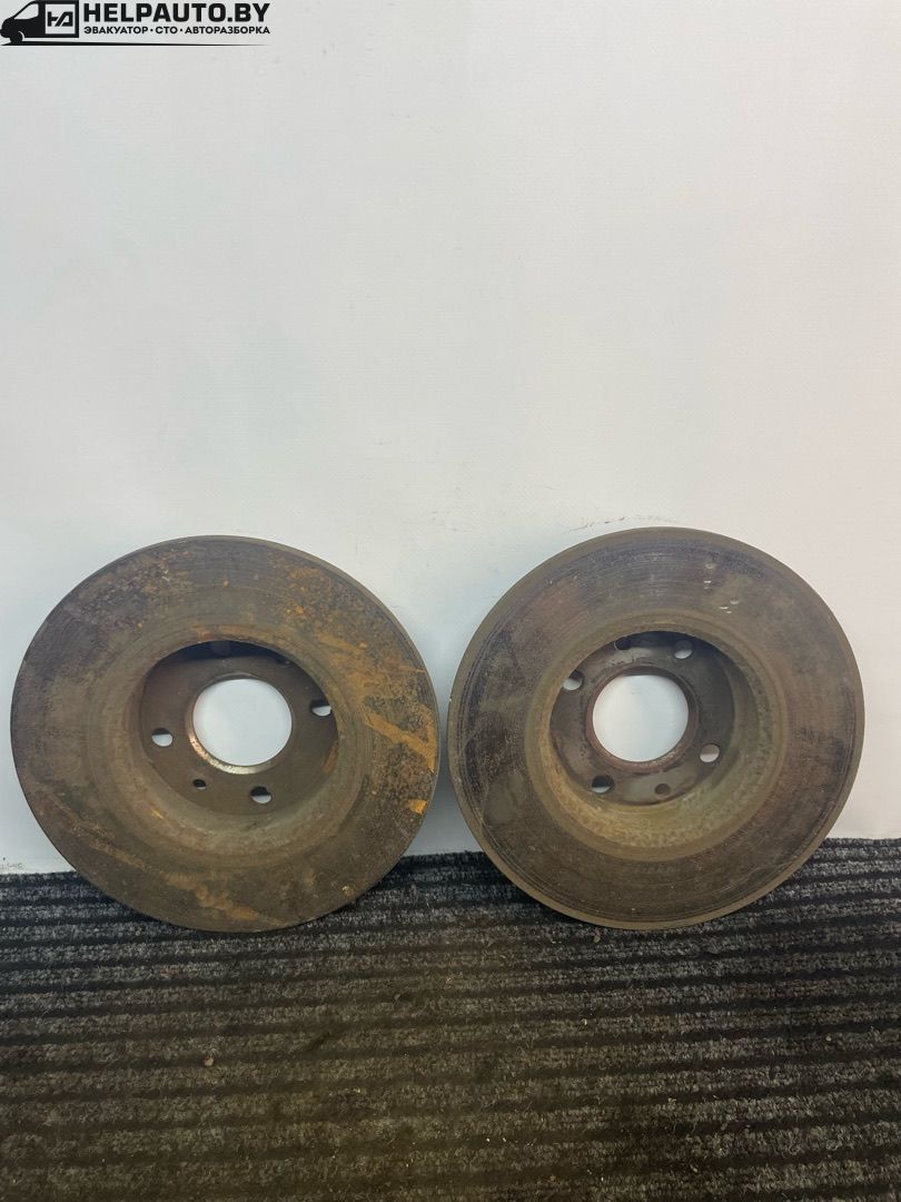 диск тормозной передний Fiat Tipo 1 поколение 1991, 1.4 л., бензин, МКПП, серебро, хетчбэк 5 дв., передний привод - фото №1