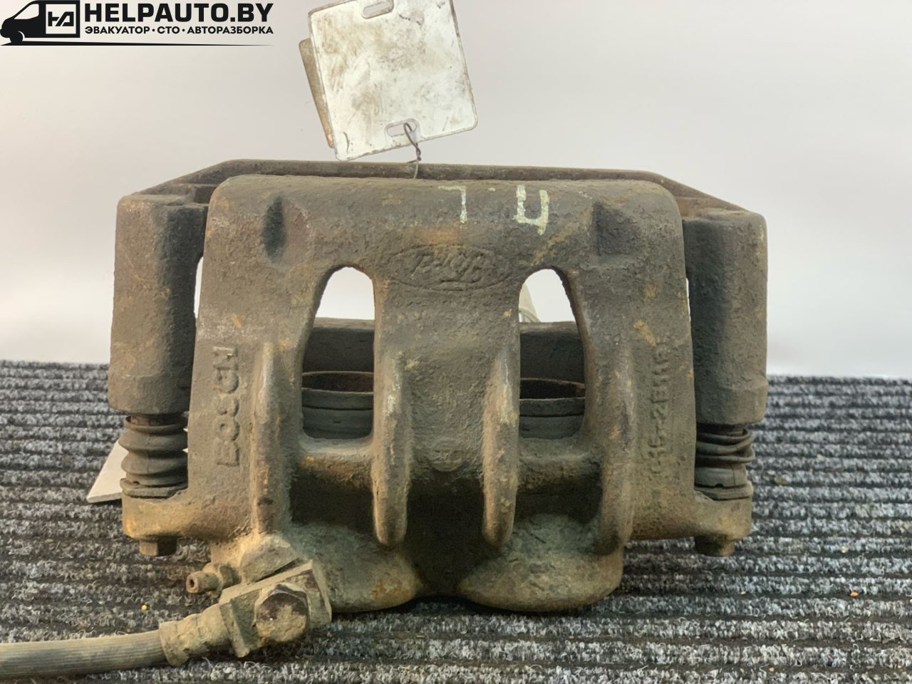 суппорт передний левый Ford Transit 6 поколение (2000 - 2006), 2.4 л., i, дизель, МКПП, микроавтобус, задний привод - фото №1