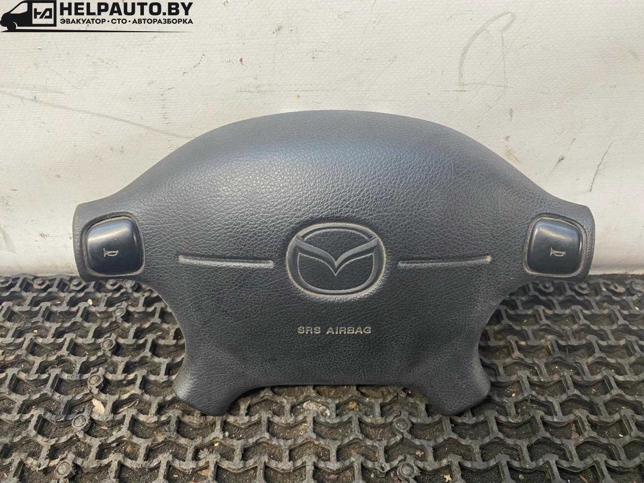 подушка безопасности водителя Mazda 323 6 поколение 1998, 1.5 л., бензин, МКПП, синий, хетчбэк 3 дв., передний привод, BG2A57K00 - фото №1