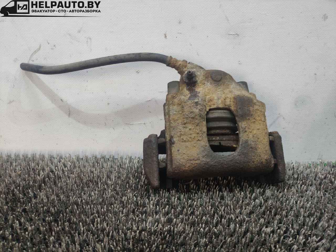 суппорт передний левый Kia Spectra 1 поколение 2000, 1.8 л., бензин, МКПП - фото №1