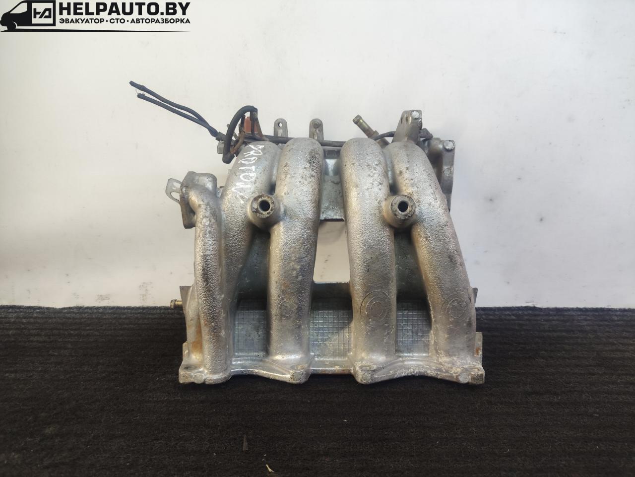 коллектор впускной Proton Persona 1 поколение 1998, 1.5 л., бензин, МКПП, зеленый, седан, передний привод - фото №1