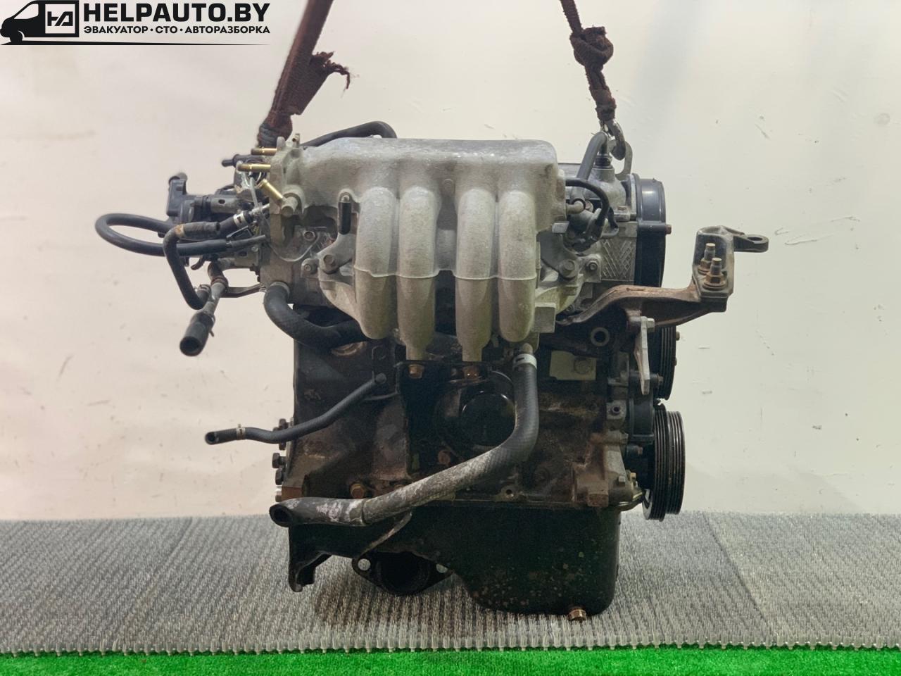 коллектор впускной Mazda 323 6 поколение 1998, 1.5 л., бензин, МКПП, синий, хетчбэк 3 дв., передний привод - фото №1