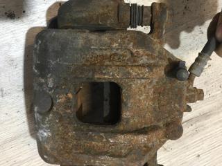 суппорт передний левый Kia Sorento 2 поколение 2012, 2.4 л., бензин, МКПП, передний привод, 581801UA00