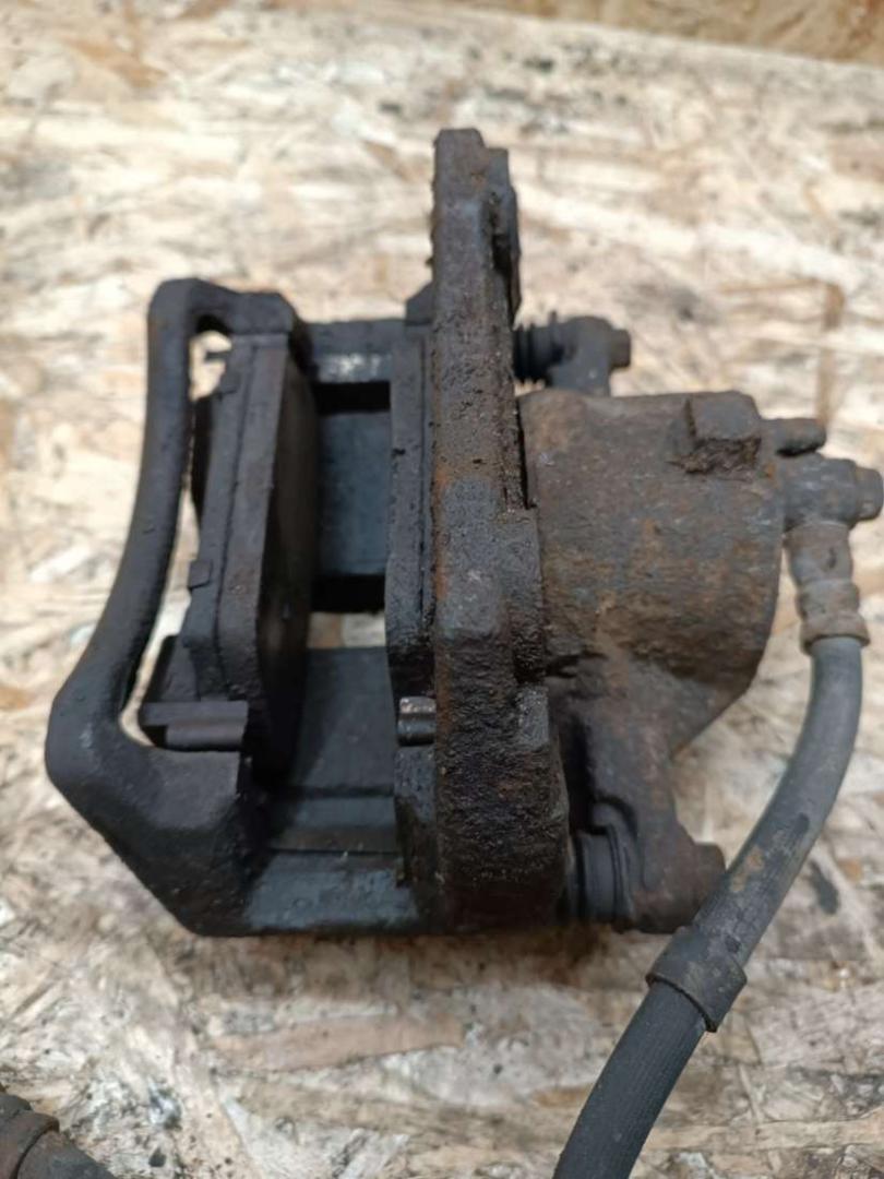 суппорт передний правый Nissan Primera P12 2004, 2.2 л., дизель, МКПП, хетчбэк 5 дв. - фото №1