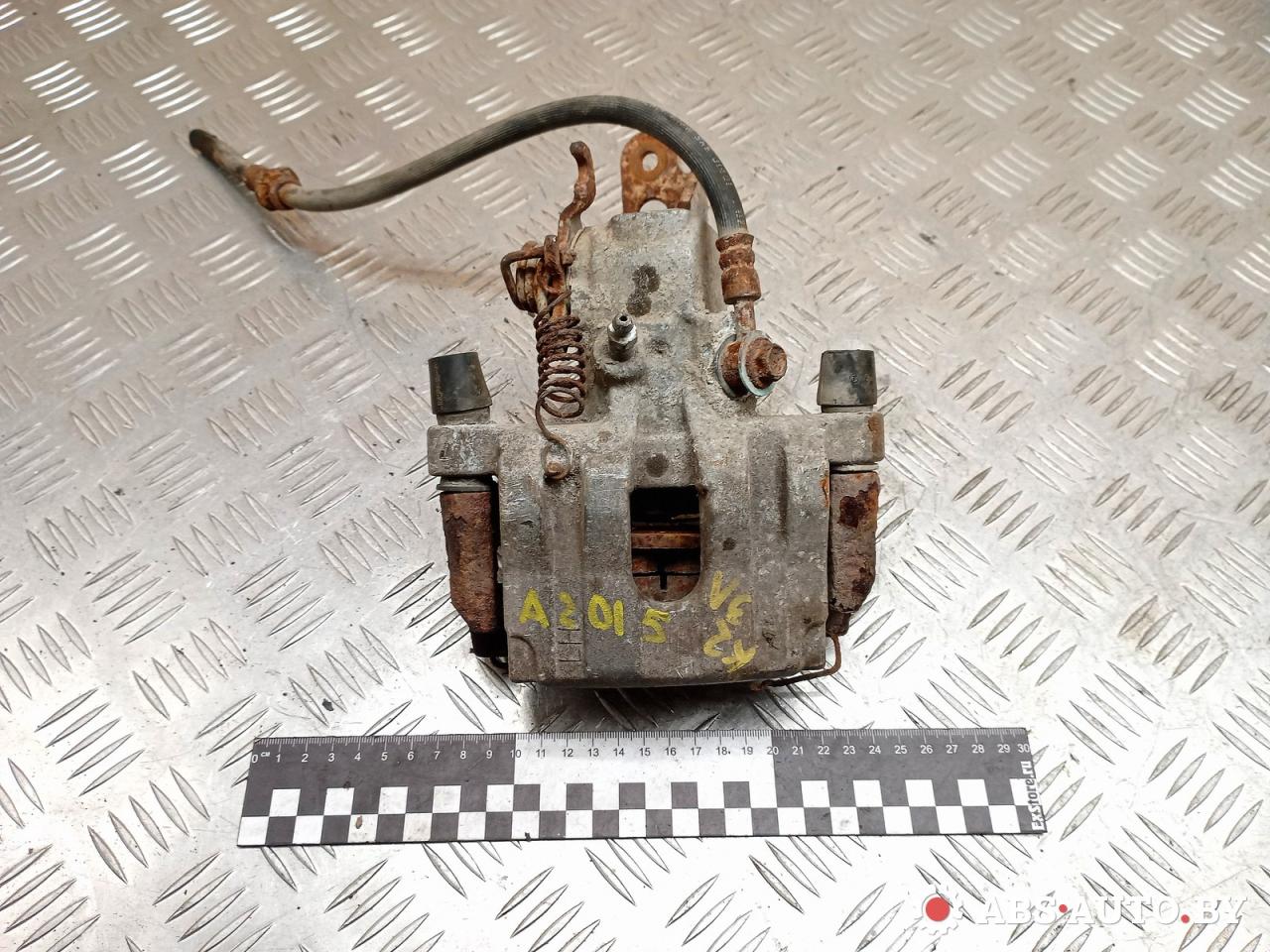 суппорт задний левый Nissan Primera P12 2003, 2.2 л., дизель, МКПП, универсал - фото №1