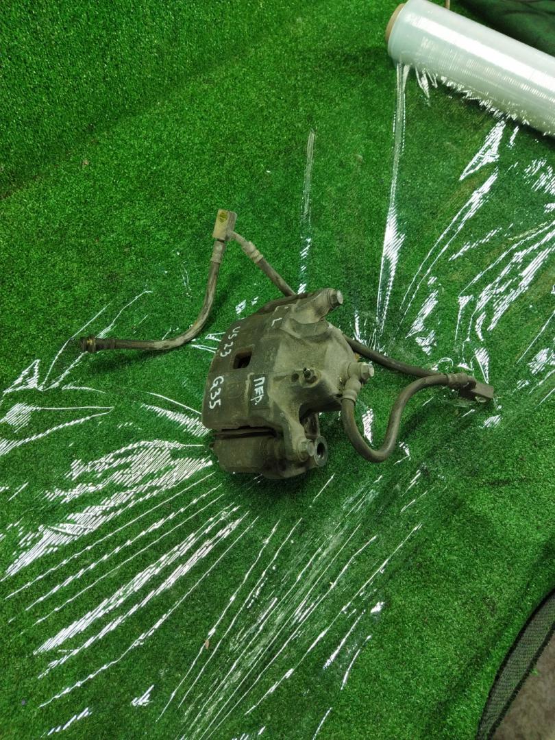 суппорт передний левый Infiniti G 3 поколение 2004, 3.5 л., VQ35DE, бензин, АКПП, черный, седан, задний привод - фото №1