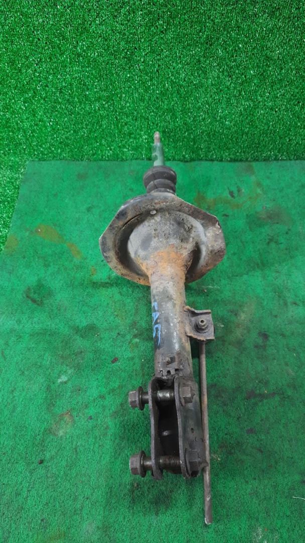 амортизатор передний левый Mitsubishi Outlander 2 поколение 2008, 3.0 л., i, 6B31, бензин, красный, внедорожник 5 дв., полный привод - фото №1