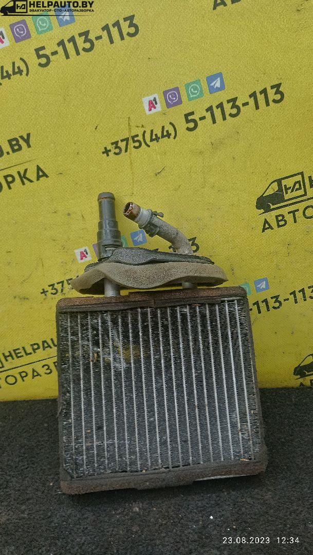 радиатор отопителя (печки) Mazda 323 6 поколение 1998, 2.0 л., дизель, МКПП, синий, хетчбэк 3 дв. - фото №1
