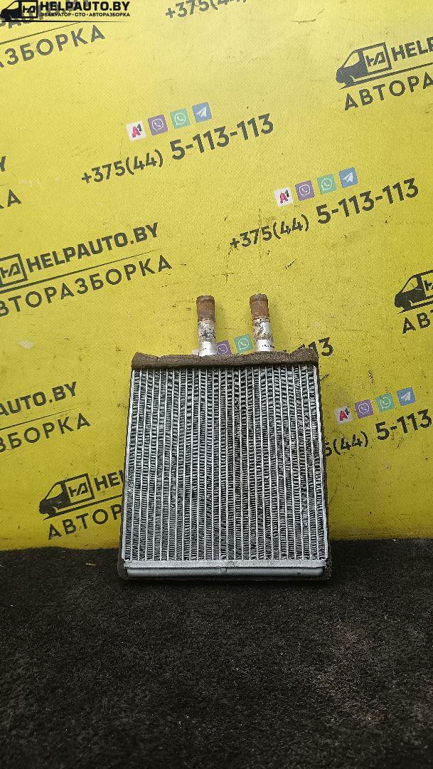 радиатор отопителя (печки) Kia Sportage 1 поколение 2001, 2.0 л., FE (16V), бензин, 5МКПП, зеленый, внедорожник 5 дв. - фото №1