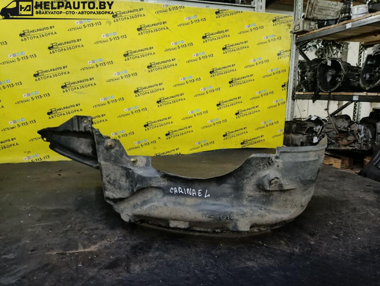 защита арок передняя левая (подкрылок) Toyota Carina E 1 поколение T190 1995, 2.0 л., 2C, дизель, МКПП, бордовый, хетчбэк 5 дв., передний привод - фото №1