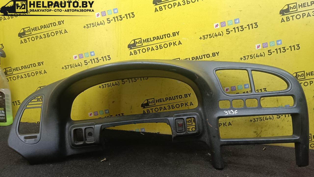 рамка панели приборов Mazda 323 5 поколение 1994, 1.8 л., BP (DOHC), бензин, МКПП, красный, хетчбэк 5 дв., передний привод - фото №1