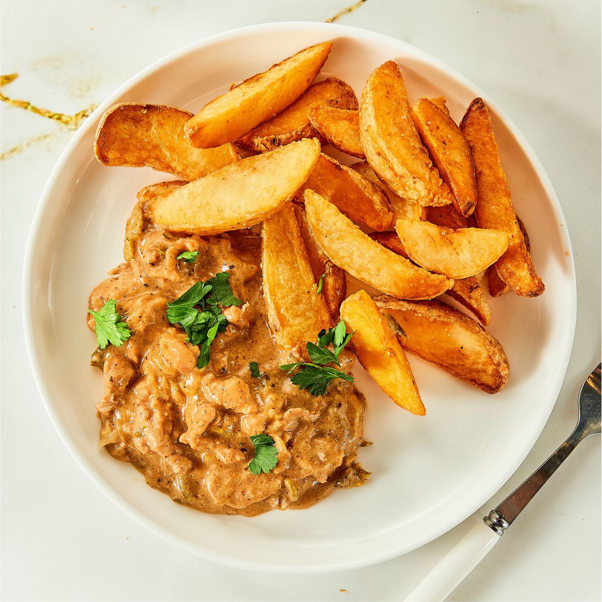 Строганов из свинины с картофелем