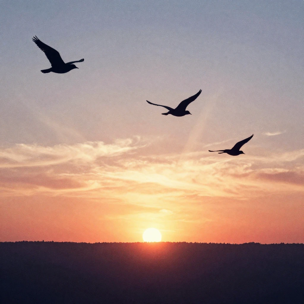 Silhouettes of birds gracefully flying towards a vibrant sun...