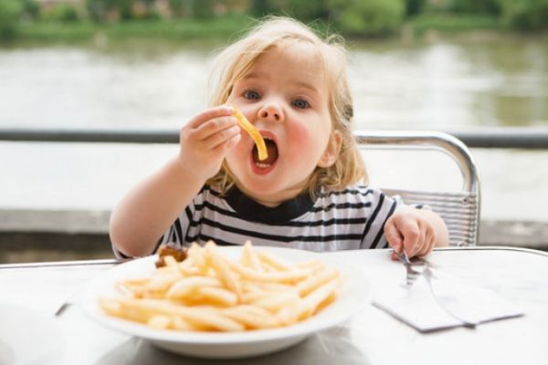 Baby eating with his hands
