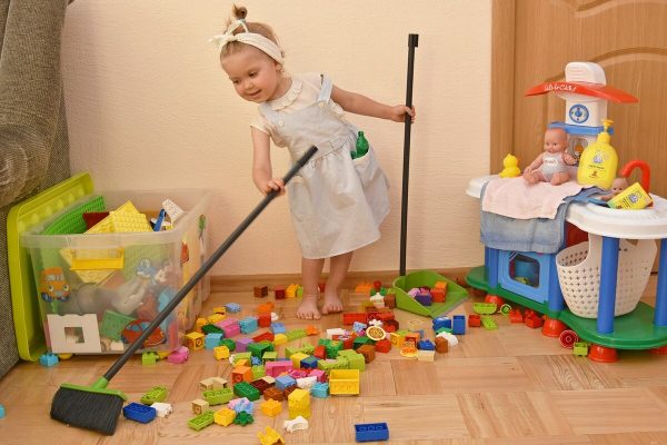 Child puts toys away