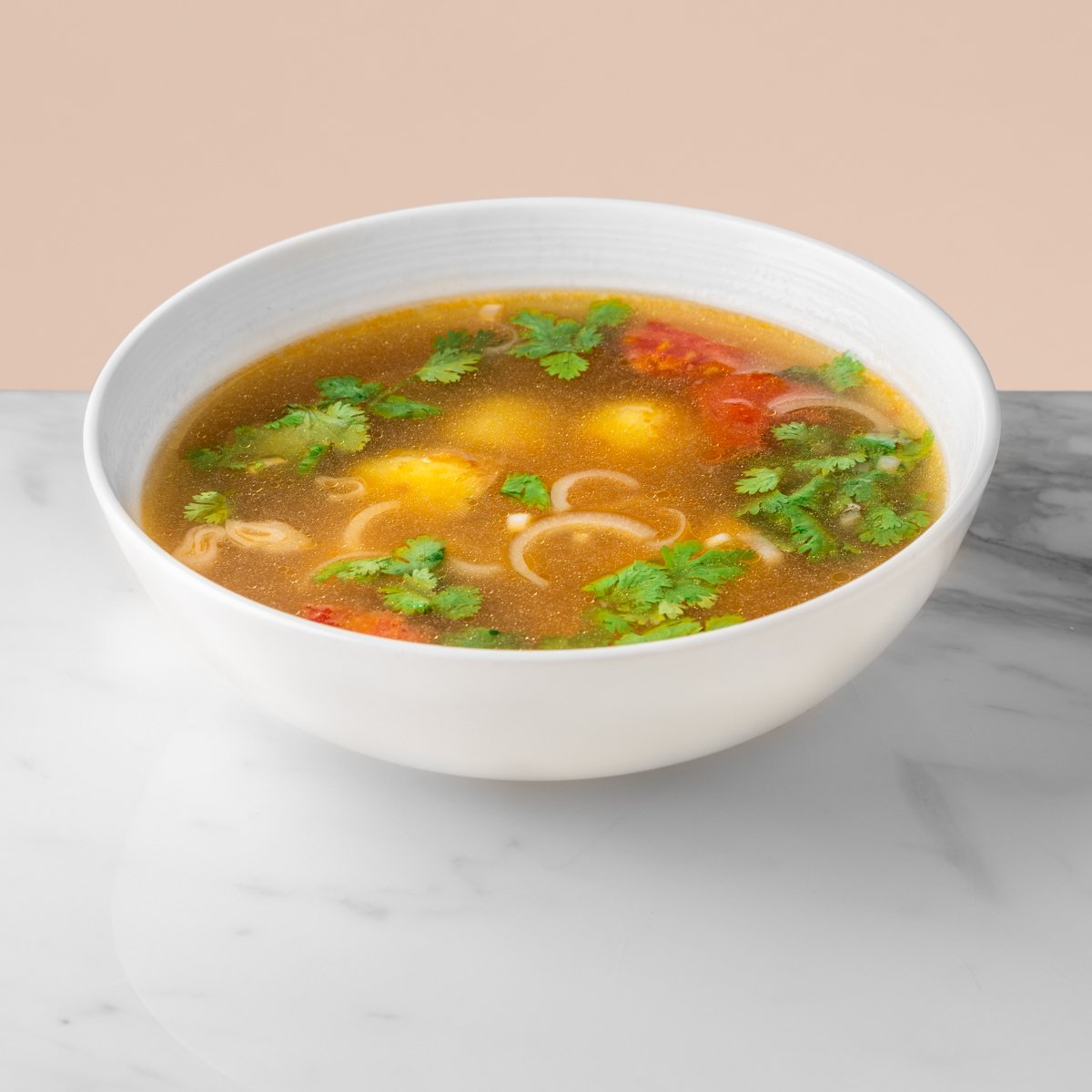 Salmon soup with tomato