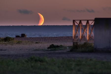 Moon, hiding behind the horizon.