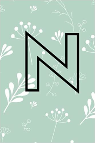 okumak N: Flower monogram initial letter &quot;N&quot; on black 6&quot;X9&quot; notebook journal diary with 120 blank college ruled pages for school, home or office. Gift for women, girls, teens, friends and co-workers