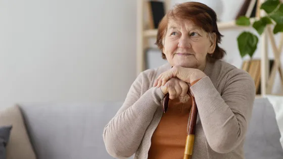 medium-shot-woman-with-walking-stick