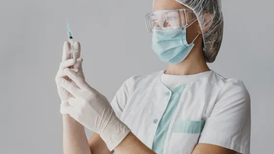 doctor-holding-syringe-vaccine