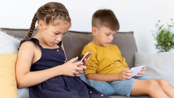 medium-shot-kids-with-devices-indoors_23-2149056211