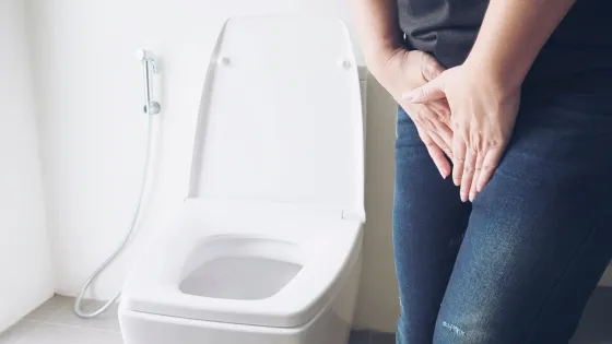 woman-holding-hand-near-toilet-bowl-health-problem-concept_1150-6442