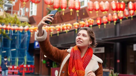 female-traveler-taking-selfie-with-her-smartphone_23-2149213036-v1