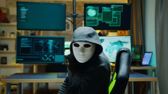 masked-hacker-wearing-hoodie-hide-his-identity-internet-criminal_482257-21751