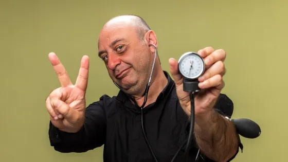 pleased-adult-ill-caucasian-man-holding-sphygmomanometer-gesturing-victory-sign-isolated-olive-green-wall-with-copy-space_141793-108329-v1