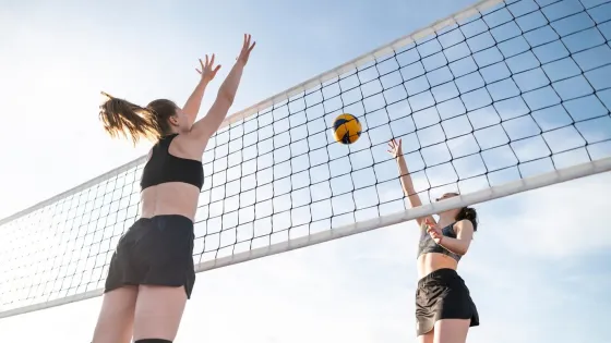 low-angle-women-playing-volleyball_52683-86490-v1